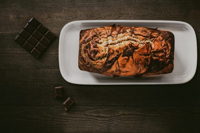 <a href="https://www.pexels.com/photo/chocolate-cake-in-white-plate-beside-chocolate-bars-890580/" target="_blank" rel="noopener">Oleg Magni</a> at Pexels